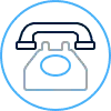 Icon of a classic rotary telephone enclosed within a double blue circular outline. The phone is drawn with simple blue and gray lines.